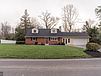 A house with a lawn in front of it

Description automatically generated