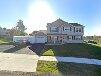 A house with a lawn and a driveway

Description automatically generated